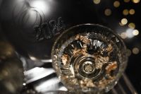 Kaboompics - Close-Up Crystal Coupe Glass with Golden Reflections