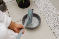 Kaboompics - Cleaning Mop Head in a Water Bowl
