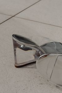Kaboompics - Transparent Block Heel Sandals with Tan Trim on a Neutral Chair