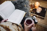 Kaboompics - Woman drinking tea and reading book