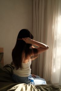 Kaboompics - Woman Reading in Bed during a Relaxed Morning