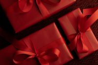 Kaboompics - Red Present with Burgundy Bow on Dark Textile