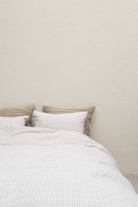Kaboompics - Minimal White Bed with Checkered Bedding