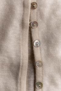 Kaboompics - Vertical Close Up of Beige Knitwear Button Front