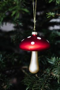 Kaboompics - Red Mushroom Christmas Ornament among Tree Branches