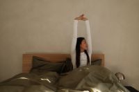 Kaboompics - Full Body Morning Stretch in a Bright Bedroom
