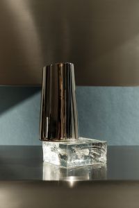 Kaboompics - Metallic Pitcher and Glass on Blue Background