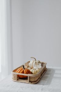 Kaboompics - Minimal Wicker Tray with Orange and White Pumpkins