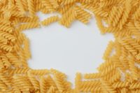 Kaboompics - Golden Fusilli Ring with Center Copy Space for Pasta Menu and Recipe Design