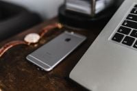 Kaboompics - Apple iPhone 6, Vintage watch on a brown leather wallet, Macbook laptop