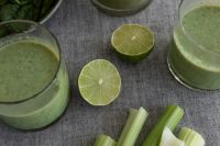 Kaboompics - Green Smoothie Glasses with Lime and Celery Close-Up