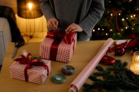 Kaboompics - Red Ribbon Bow on Striped Christmas Present