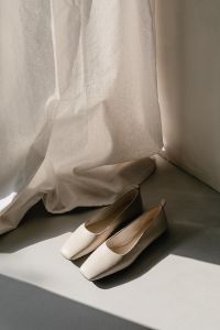 Kaboompics - White Pointed Pumps in Sunlit Interior