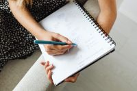 Kaboompics - Student Taking Notes in School Notebook