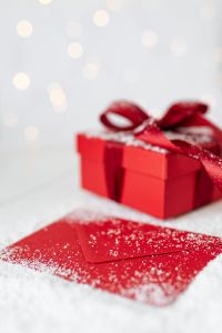 Kaboompics - Red Christmas Box and Matching Envelope with Soft Bokeh Lights