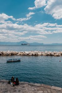 Kaboompics - Small Boat and Mount Vesuvius Beyond the Naples Breakwater