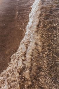 Kaboompics - Narrow White Wave Line on a Sandy Beach
