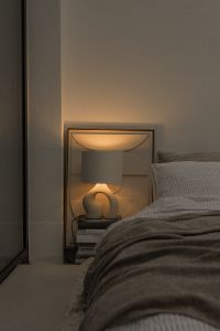 Kaboompics - Bedside Lamp and Cozy Gray Bedding