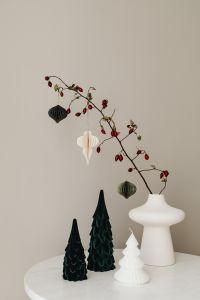 Kaboompics - Woman Holding Neutral Vase With Christmas Greenery