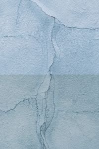 Kaboompics - Pale Blue Cracked Plaster with Horizontal Seam