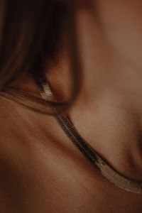 Kaboompics - Gold Chain Necklace Detail on Woman's Neck