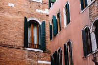 Kaboompics - Flower-Lined Balcony on a Rose-Colored Venetian Building