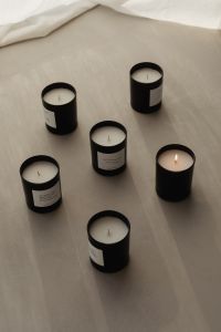 Kaboompics - Scented Candles Arranged on Flowing White Fabric