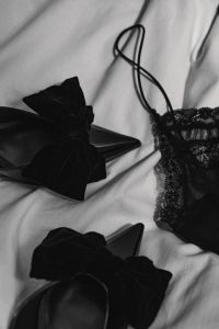 Kaboompics - Black Lingerie and Satin Bows on White Bedding