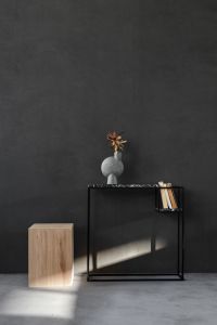 Kaboompics - Charcoal Wall and Black Console Styling with Sculptural Vase, Books and Cube Table