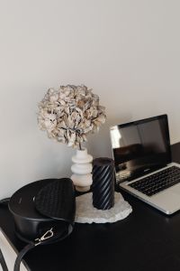 Kaboompics - Home Office Desk with Laptop, Black Candle and Dried Flower Vase, Copy Space