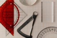 Kaboompics - Drafting Compass and Red Protractor on Coordinate Paper