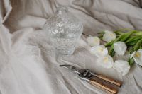 Kaboompics - Neutral Spring Flat Lay of White Tulips, Glass Vase and Pruners on Linen with Copy Space