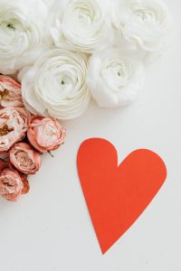 Kaboompics - Vertical Floral Flat Lay with a Red Paper Heart