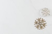 Kaboompics - Silver Snowflake and Glitter Bauble on White Marble Background