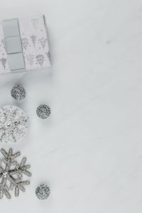 Silver Christmas Decorations on White Marble Backgrounds with Copy Space