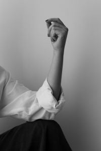 Kaboompics - Expressive Raised Arm in Black and White Fashion Portrait