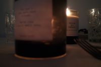 Kaboompics - Amber Candles and Gold Forks on White Tablecloth