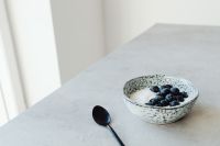 Kaboompics - Minimal Yogurt Bowl with Blueberries and Black Spoon