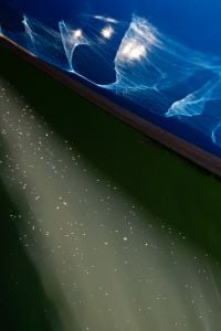 Kaboompics - Blue Boat Reflection Creating Abstract Water Pattern