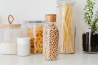 Kaboompics - Close-Up Glass Jars of Chickpeas, Flour and Spaghetti for Pantry Storage
