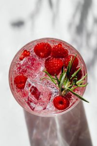 Kaboompics - Raspberry Drink With Ice From Above