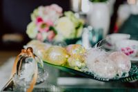 Kaboompics - Glass Cloche with a White Flower beside Decorative Eggs and a Spring Bouquet