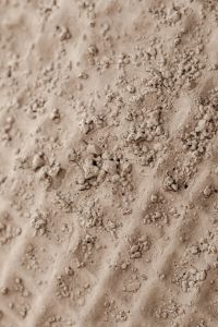 Kaboompics - Rough Ivory Plaster Texture with Dense Irregular Bumps and Raised Clusters