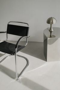 Kaboompics - Close-Up Chrome-Frame Chair and Reflective Side Table