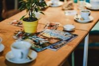 Kaboompics - Cups of coffee and magazines on a table