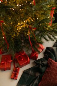 Kaboompics - Christmas Tree With Gifts and Cozy Winter Textiles