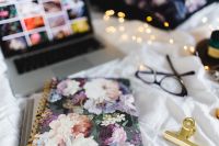 Kaboompics - Floral Notebook And Laptop For Creative Work From Bed