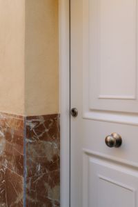 Kaboompics - White Paneled Door with Marble Base