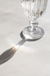 Kaboompics - Crystal Goblet Stem and Long Shadow on White Marble
