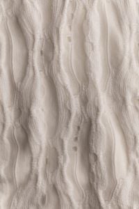 Kaboompics - Vertical Cream Cable Knit Texture Close Up